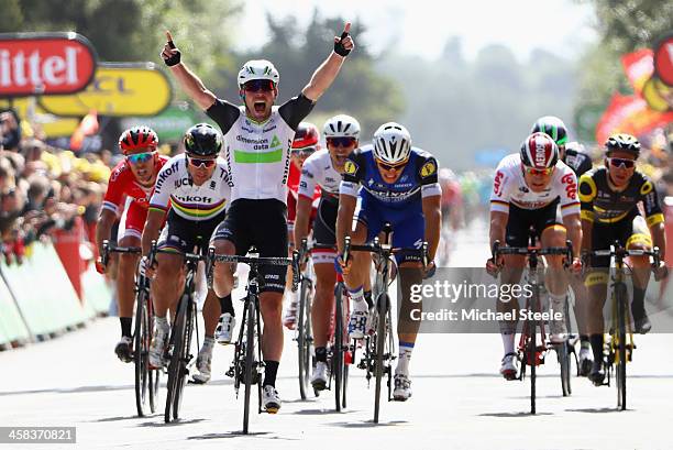 Mark Cavendish of Great Britain and Team Dimension Data celebrates as he crosses the finish line ahead of Marcel Kittel of Germany and Etixx-Quick...