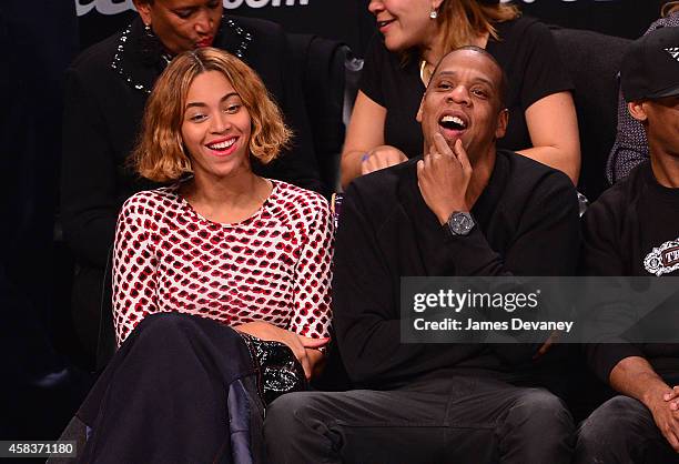 Beyonce Knowles and Jay-Z attend the Oklahoma City Thunder vs Brooklyn Nets game at Barclays Center on November 3, 2014 in the Brooklyn borough of...