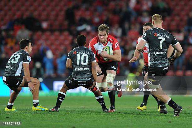 Andries Ferreira of Lions in action with Garth April,Paul Jordaan and Jean-Luc de Preez of Sharks during the Super Rugby match between Emirates Lions...