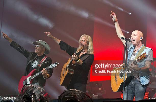 Fritz Puppel, Bernd Roemer and Toni Krahl of the German bands City and Karat perform live during the concert Rock Legends at the O2 World on November...