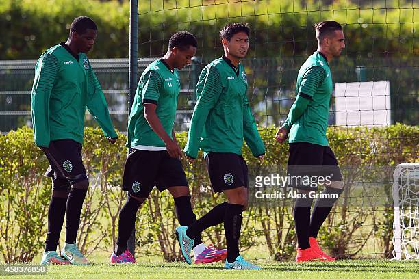 William Carvalho, Andre Carrillo, Junya Tanaka and Paulo Lopes arrive for a Sporting Club de Portugal training session ahead of their UEFA Champions...