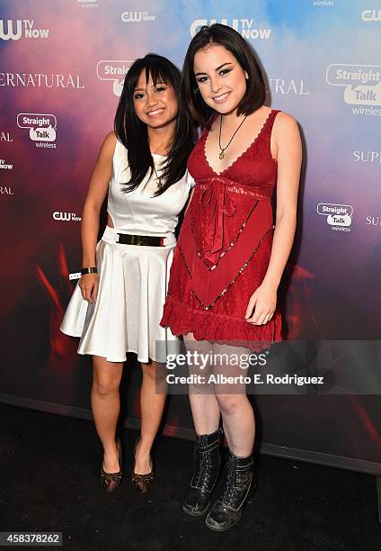 Actors Joy Regullano and Katie Sarife attend the CW's Fan Party to Celebrate the 200th episode of "Supernatural" on November 3, 2014 in Los Angeles,...