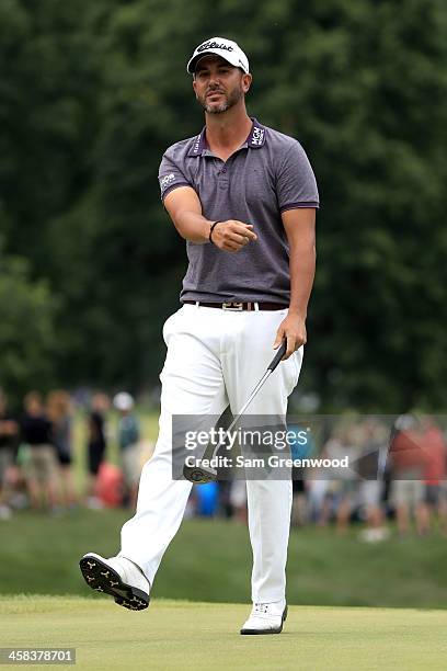 Scott Piercy reacts after a putt on the 13th green during the third round of the World Golf Championships - Bridgestone Invitational at Firestone...