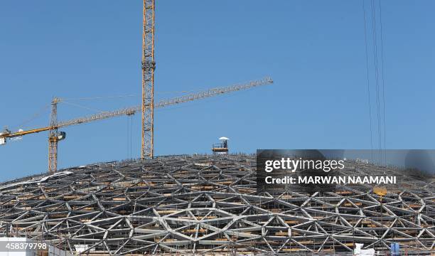 Picture taken on November 4, 2014 shows a detail of the dome structrure of the future Louvre museum still under contruction on Saadiyat island, near...