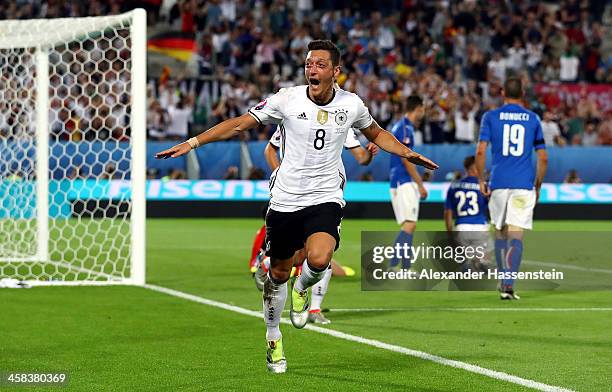 Mesut Oezil of Germany celebrates scoring the opening goal during the UEFA EURO 2016 quarter final match between Germany and Italy at Stade Matmut...