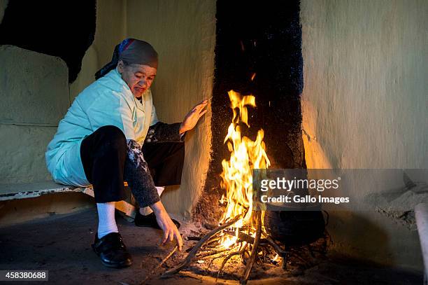 Toes Ockhuis makes a fire in her kitchen on September 17, 2014 in Clanwilliam. Heuningvlei is a small village situated in the heart of the Cederberg...