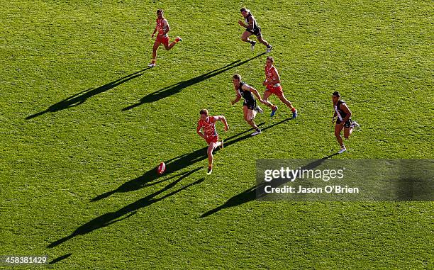 Peter Wright of the suns chases the ball during the round 15 AFL match between the Gold Coast Suns and the St Kilda Saints at Metricon Stadium on...