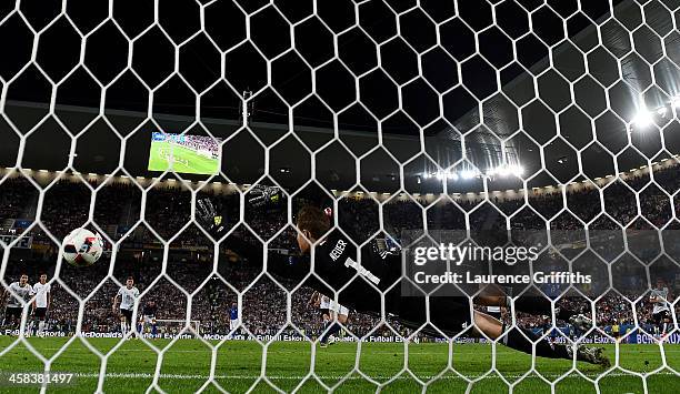 Manuel Neuer of Germany dives in vain as Leonardo Bonucci of Italy converts the penalty to score his team's first goal during the UEFA EURO 2016...