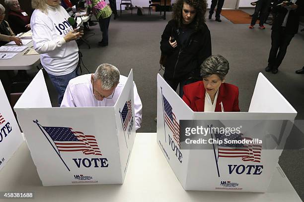 Republican U.S. Senate candidate Joni Ernst and her husband Gail Ernst fill in their ballots on election day at the polling place in their hometown...