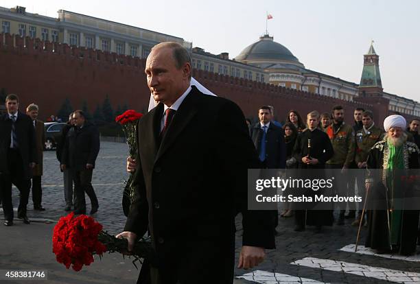 Russian President Vladimir Putin attends a ceremony honouring the National Unity Day on Red Square on November 4, 2014 in Moscow, Russia. A national...