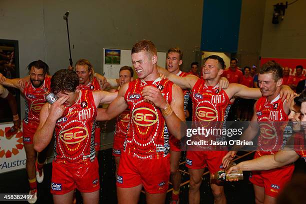 Peter Wright and Jesse Joyce of the suns celebrate during the round 15 AFL match between the Gold Coast Suns and the St Kilda Saints at Metricon...