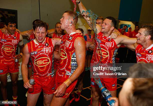 Peter Wright and Jesse Joyce of the suns celebrate during the round 15 AFL match between the Gold Coast Suns and the St Kilda Saints at Metricon...