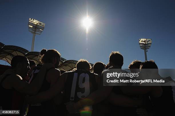 Players of the Saints huddle before the round 15 AFL match between the Gold Coast Suns and the St Kilda Saints at Metricon Stadium on July 2, 2016 in...