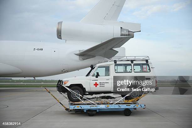 Jeep of the German Red Cross , part of a 25-ton shipment of tents, generators, air-conditioning units, chlorine for disinfection and other supplies...