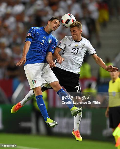 Mattia De Sciglio of Italy and Joshua Kimmich of Germany compete for the ball during the UEFA EURO 2016 quarter final match between Germany and Italy...