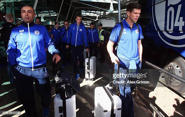 Head coach Roberto di Matteo and Klaas-Jan Huntelaar of FC Schalke 04 arrive at Lisbon airport one day ahead of their UEFA Champions League Group G...