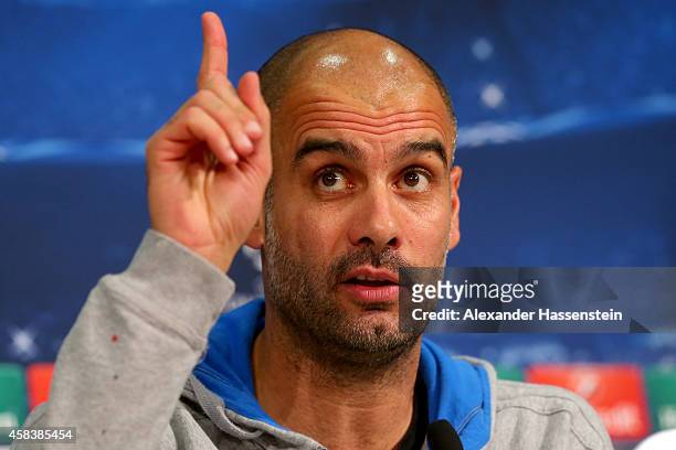 Josep Guardiola, head coach of Bayern Muenchen reacts during a press conference prior to their UEFA Champions League match against AS Roma at Allianz...