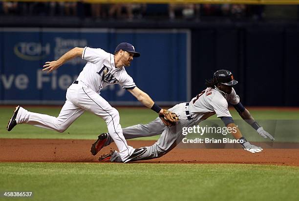 Second baseman Logan Forsythe of the Tampa Bay Rays catches Cameron Maybin of the Detroit Tigers attempting to steal second base during the first...