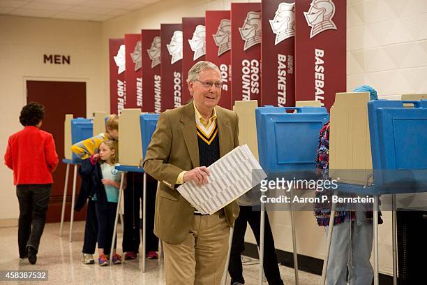 Senate Minority Leader U.S. Sen. Mitch McConnell holds his ballot after voting in the midterm elections at Bellarmine University November 4, 2014 in...