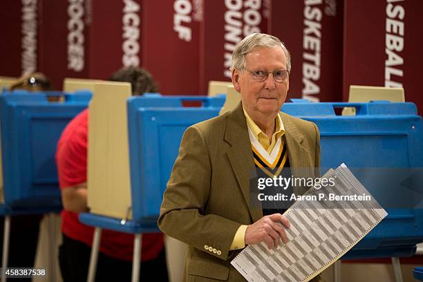 Senate Minority Leader U.S. Sen. Mitch McConnell holds his ballot after voting in the midterm elections at Bellarmine University November 4, 2014 in...