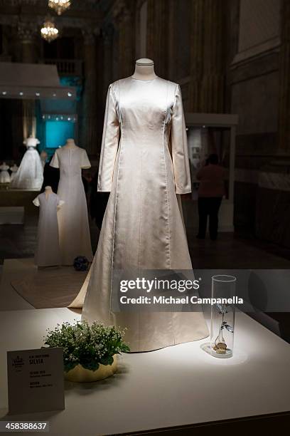 The wedding dress of Queen Silvia of Sweden designed by Marc Bohan is seen on display during an exhibition at the Royal Palace on October 17, 2016 in...