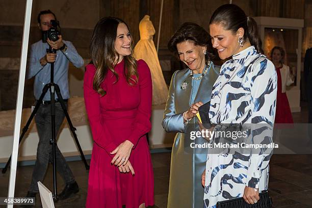 Princess Sofia, Queen Silvia, and Crown Princess Victoria of Sweden attend an exhibition of royal wedding dresses at the Royal Palace on October 17,...