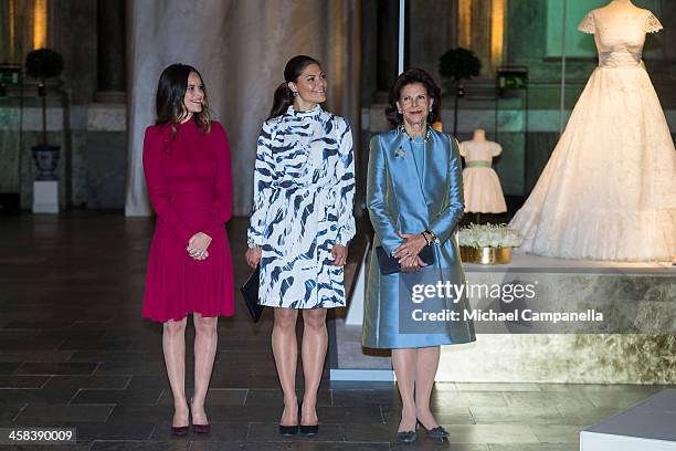 Princess Sofia, Crown Princess Victoria, and Queen Silvia of Sweden attend an exhibition of royal wedding dresses at the Royal Palace on October 17,...