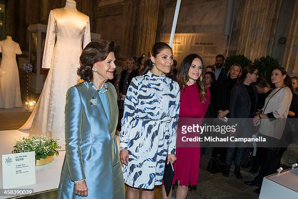Queen Silvia, Crown Princess Victoria, and Princess Sofia of Sweden attend an exhibition of royal wedding dresses at the Royal Palace on October 17,...