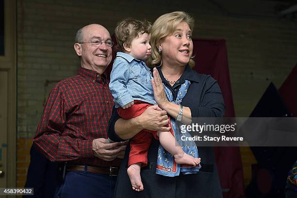 Sen. Mary Landrieu stands with her husband Frank Snellings while holding her grandson Maddox after casting her vote on November 4, 2014 in New...