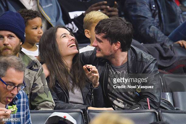 Claudia Traisac and Josh Hutcherson attend a basketball game between the Toronto Raptors and the Los Angeles Clippers at Staples Center on November...