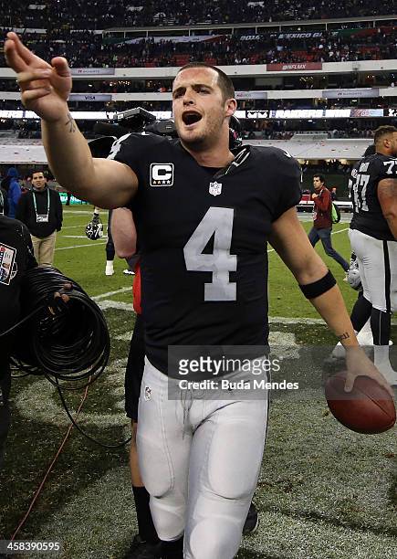 Derek Carr of the Oakland Raiders celebrates after defeating the Houston Texans at Estadio Azteca on November 21, 2016 in Mexico City, Mexico.