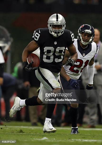 Amari Cooper of the Oakland Raiders runs after catching a pass during the fourth quarter against the Houston Texans at Estadio Azteca on November 21,...