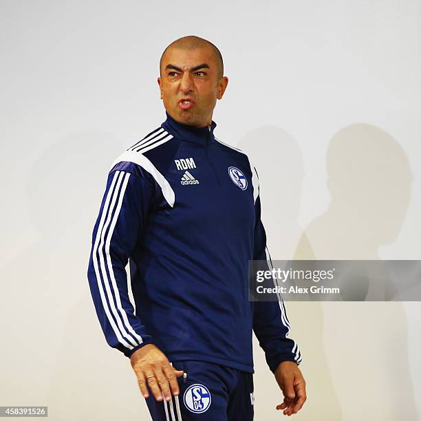 Head coach Roberto di Matteo frowns as he arrives for a FC Schalke 04 press conference ahead of their UEFA Champions League Group G match against...