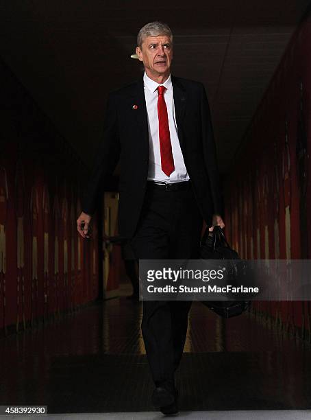 Arsenal manager Arsene Wenger arrives at the home team changing room before the UEFA Champions League Group D match between Arsenal and Anderlecht at...