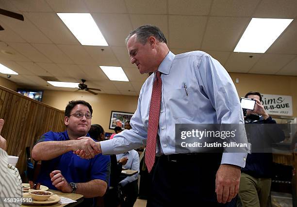 Sen. Mark Pryor greets customers at Sim's BBQ on November 4, 2014 in Little Rock, Arkansas. As voters in Arkansas vote on election day, U.S. Sen....