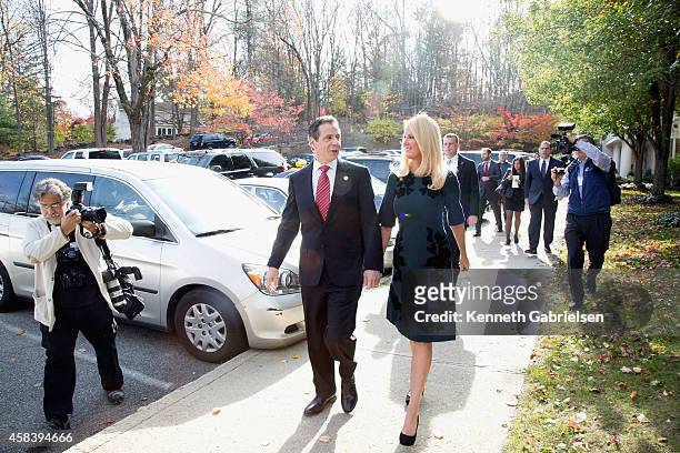 New York State Governor, Andrew Cuomo , and his girlfriend, television personality Sandra Lee, arrive to vote during the 2014 general election at the...