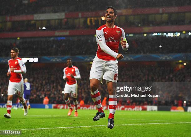 Mikel Arteta of Arsenal celebrates as he scores their first goal from the penalty spot during the UEFA Champions League Group D match between Arsenal...
