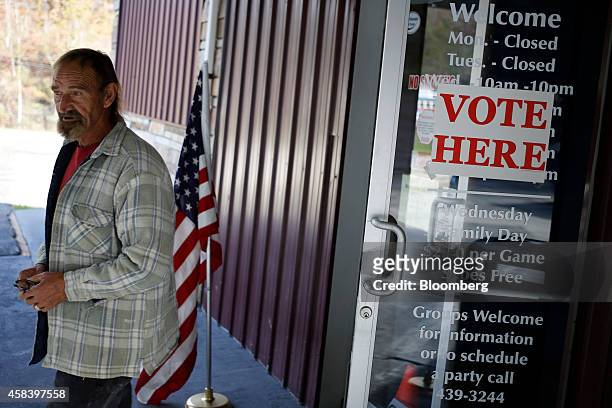 Voter Adam Hensley depaarts from a polling station at Fugate's Bowling Alley after casting his ballot in Hazard, Kentucky, U.S. On Tuesday, on Nov....