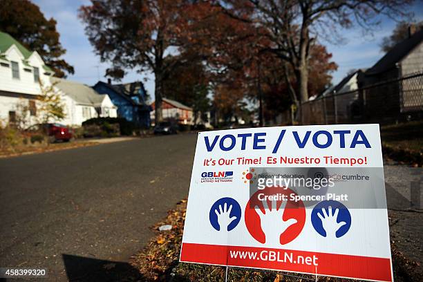 Sign advocating voting is seen outside of a polling station on November 4, 2014 in Bridgeport, Connecticut. Around the country voters are turning out...