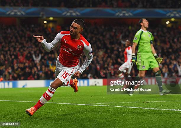 Despair for Silvio Proto of Anderlecht as Alex Oxlade-Chamberlain of Arsenal celebrates as he scores their third goal during the UEFA Champions...