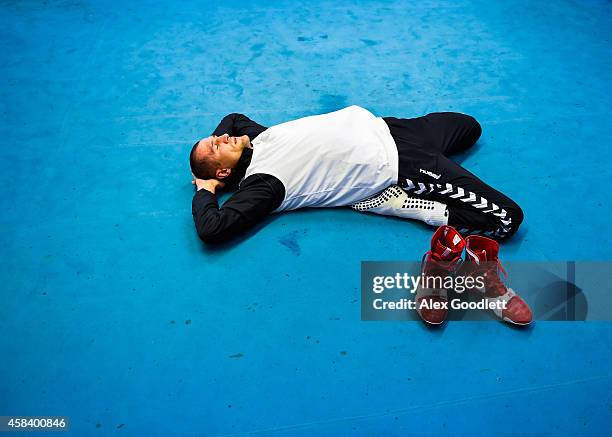 Russian boxer Sergey Kovalev stretches after a training session for an upcoming fight against Bernard Hopkins at Gleason's Gym on November 4, 2014 in...