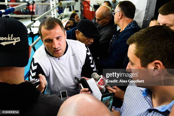 Russian boxer Sergey Kovalev speaks to the media before a workout at Gleason's Gym on November 4, 2014 in the Brooklyn borough of New York City.