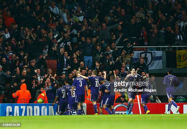 Players celebrate in front of their fans as Aleksandar Mitrovic of Anderlecht scores their third goal during the UEFA Champions League Group D match...