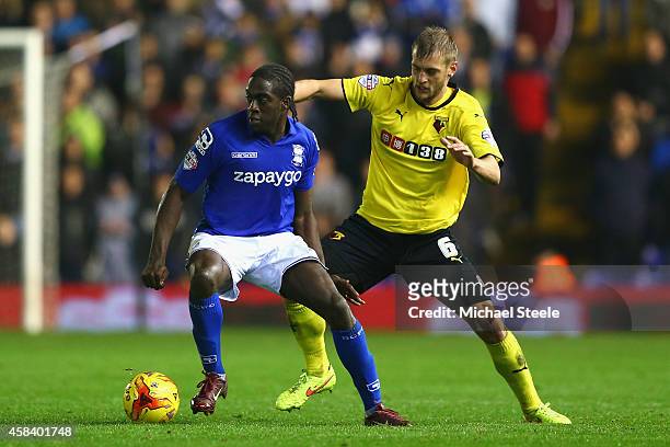 Clayton Donaldson of Birmingham City is tracked by Joel Ekstrand of Watford during the Sky Bet Championship match between Birmingham City and Watford...