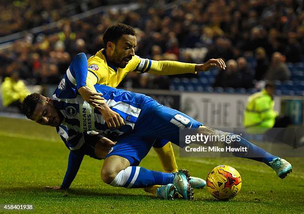 Jake Forster-Caskey of Brighton tangles with James Perch of Wigan during the Sky Bet Championship match between Brighton & Hove Albion and Wigan...