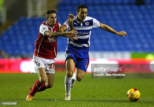 Stephen Kelly of Reading holds off the challenge of Matt Derbyshire of Rotherham during the Sky Bet Championship match between Reading and Rotherham...