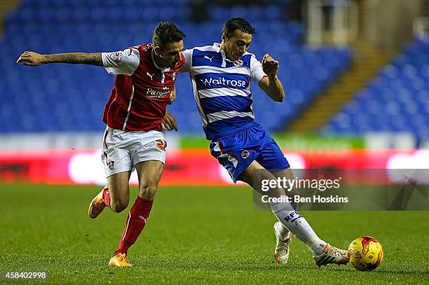 Stephen Kelly of Reading holds off the challenge of Matt Derbyshire of Rotherham during the Sky Bet Championship match between Reading and Rotherham...