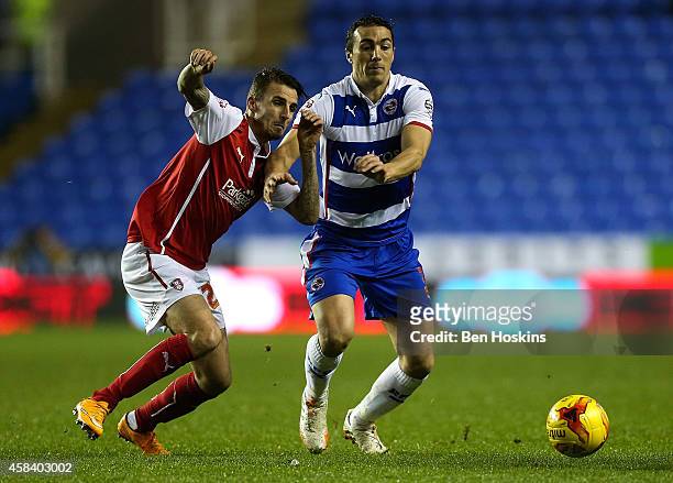 Stephen Kelly of Reading holds off the challenge of Matt Derbyshire of Rotherham during the Sky Bet Championship match between Reading and Rotherham...