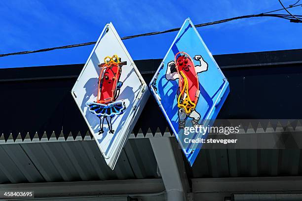 vintage neon signs at a chicago hot dog drive-in - chicago neon signs stock pictures, royalty-free photos & images