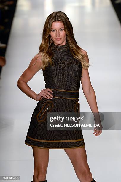 Brazilian supermodel Gisele Bundchen presents a creation by Colcci during the 2015 Winter collection of the Sao Paulo Fashion Week, in Sao Paulo,...